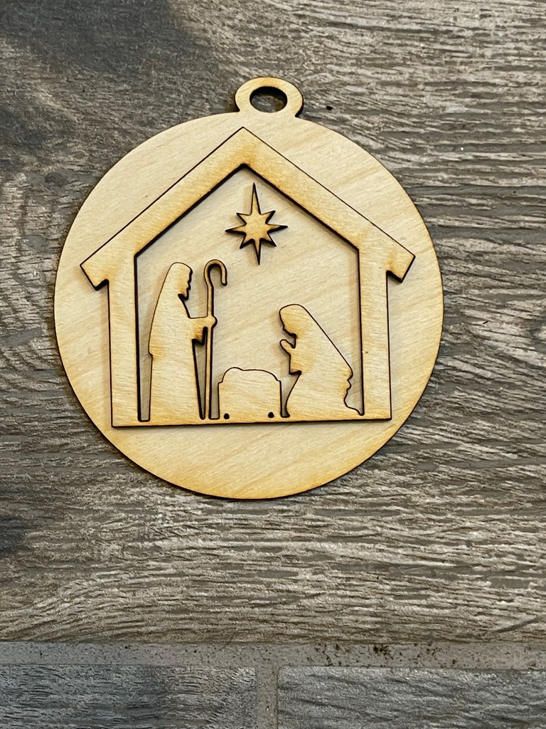 A Little August Ranch DIY Christmas Tree Ornament Wood Blanks - Christian Christmas Tree Ornaments - Nativity Ornament hanging on a Christmas tree.