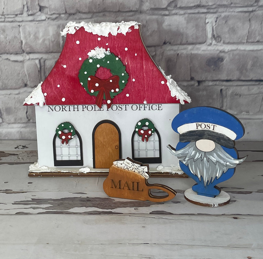 A Little August Ranch wooden house with a mailbox and santa claus.