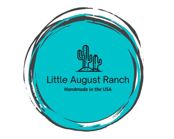 Logo of Little August Ranch featuring a cactus and the tagline &quot;handmade in the USA&quot; within a circular turquoise border, showcasing their specialty in Summer Highland Cow Tiered Tray DIY Kit - Quick and Easy Tiered Tray Bundle items.