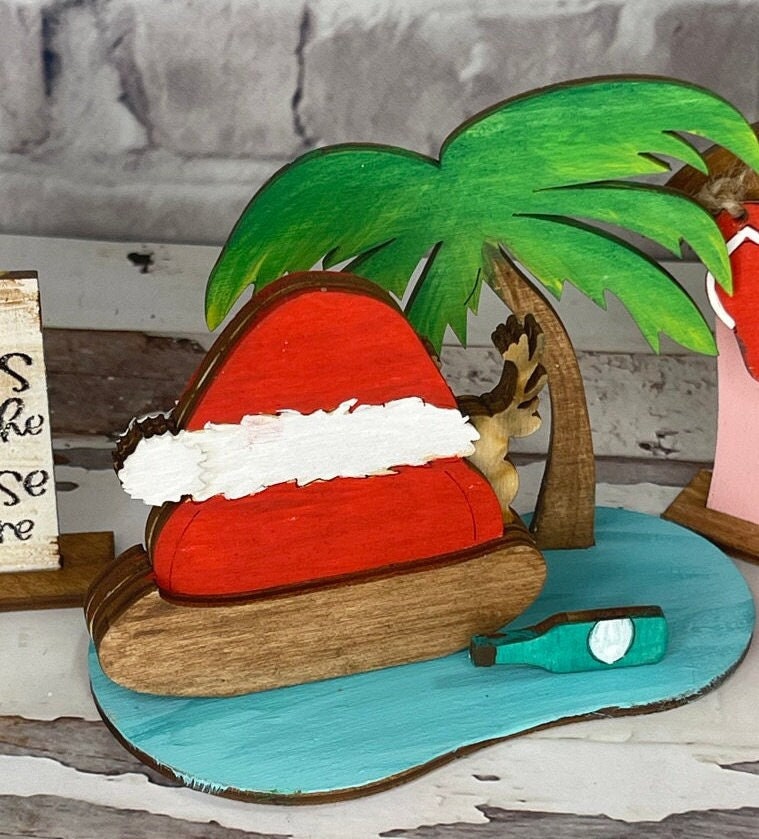 A Beach Santa DIY Craft Tiered Tray Kit from Little August Ranch featuring Santa on a table.