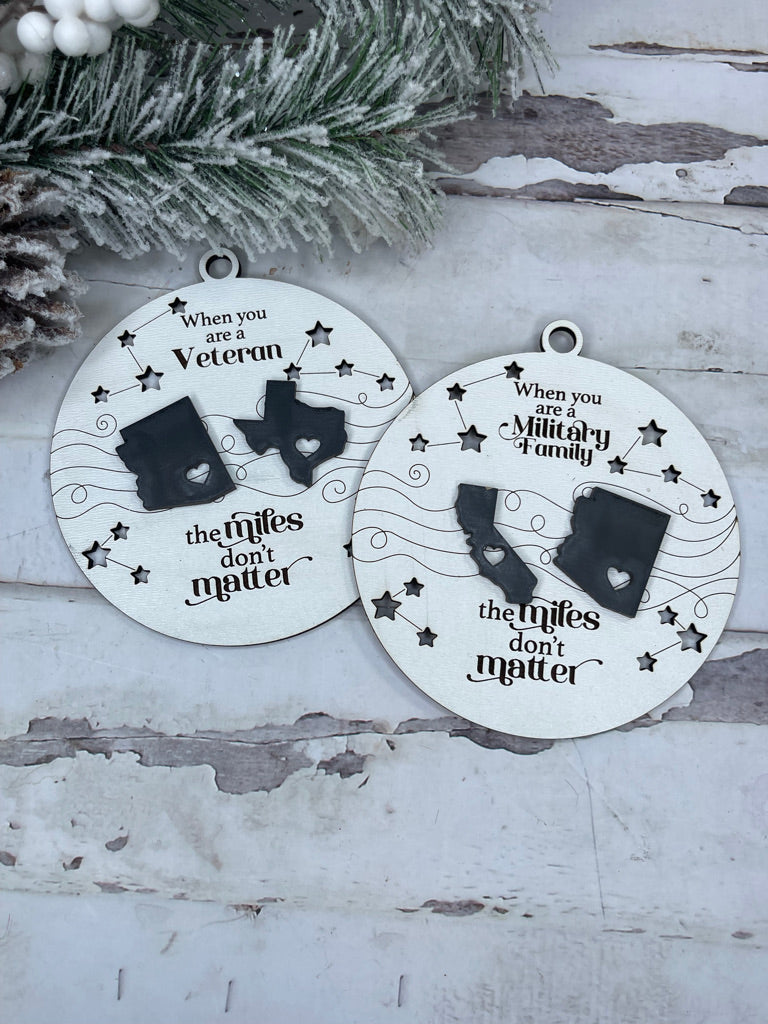 Two Little August Ranch Military Family Ornaments - State to State Wood Christmas Ornaments - Personalized Ornaments with the words California and Texas on them, offering custom title and finish style options.