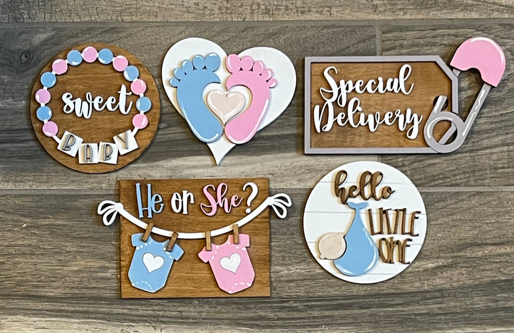 A collection of Baby Tiered Tray DIY Kits from Little August Ranch for a baby shower, perfect for those looking to paint and decorate their own tiered tray with adorable wood items. The kit includes Gender Reveal Wood Blanks.