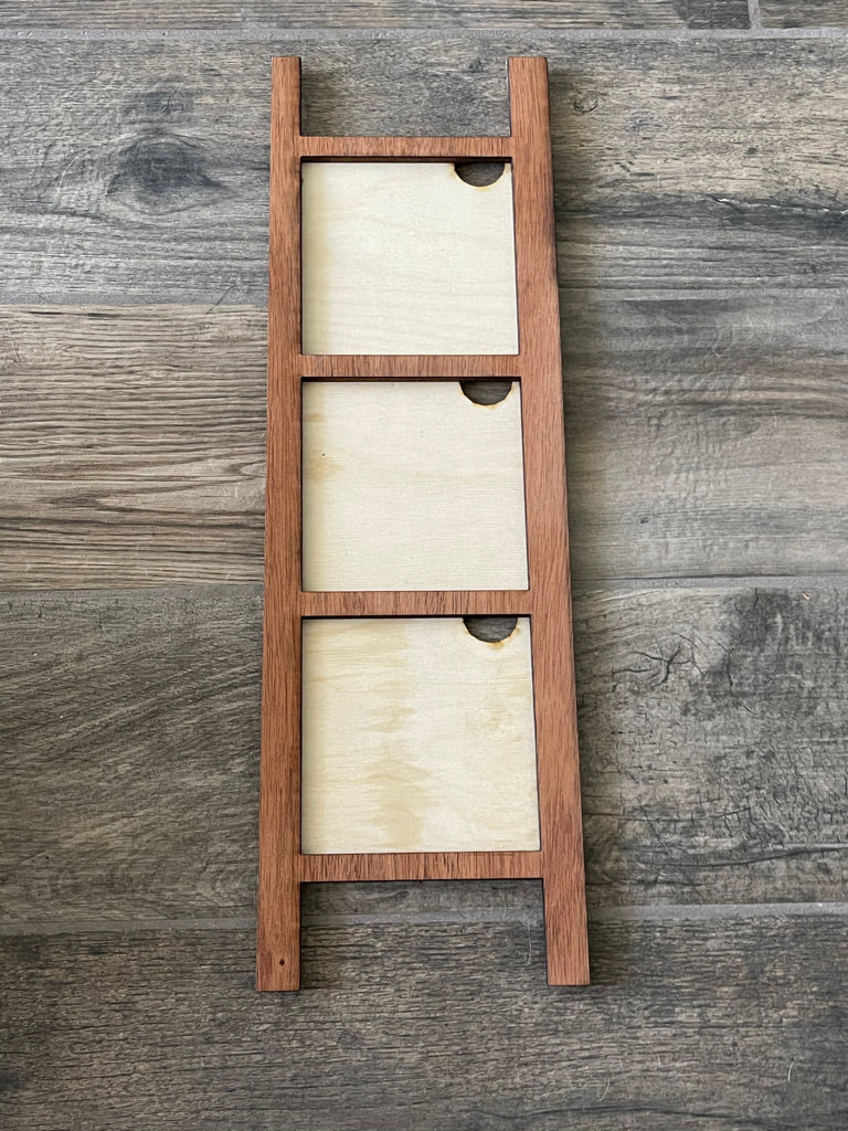 Three Little August Ranch wooden trays and frames on a wooden floor.