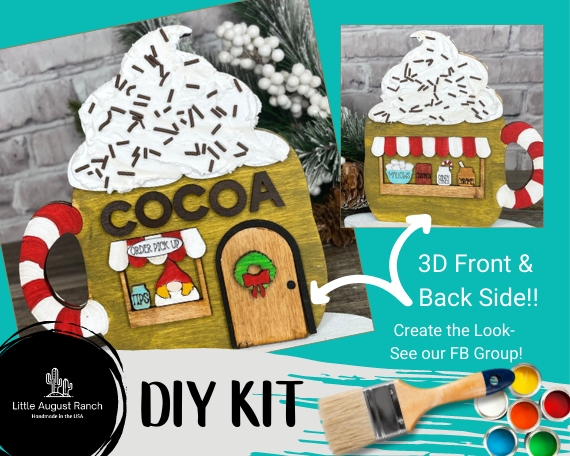 A promotional image for a Christmas Village Self Standing Double Sided Pieces - Cocoa Hut DIY kit featuring a 3D wooden cocoa stand with a whipped cream roof from Little August Ranch.