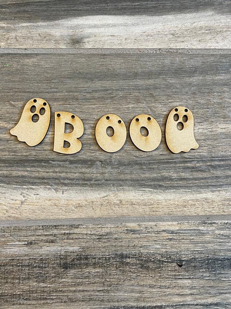 A set of wooden ghosts with the word boo on them, perfect for Halloween decor or as wood pieces for a Little August Ranch DIY Halloween Tiered Tray - Candy Corn Tier Tray Bundle display.