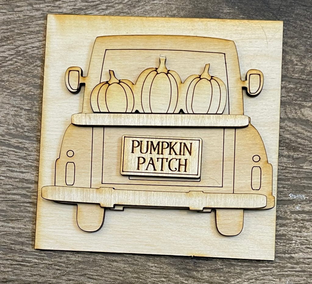 Wooden carving of a truck carrying pumpkins with "pumpkin patch" sign, part of the Fall Farm Square DIY Decor - Fall Pumpkin Patch DIY Bundle - Leaning Ladder Insert Kit - Interchangeable Fall Decor - Sunflower Fall DIY by Little August Ranch.