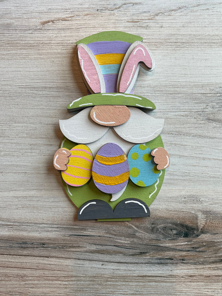An Easter Bunny Gnome with Eggs DIY Wood Paint Kit- Standing Gnome on Base - DIY Paint Kit decoration by Little August Ranch, on a wood surface.
