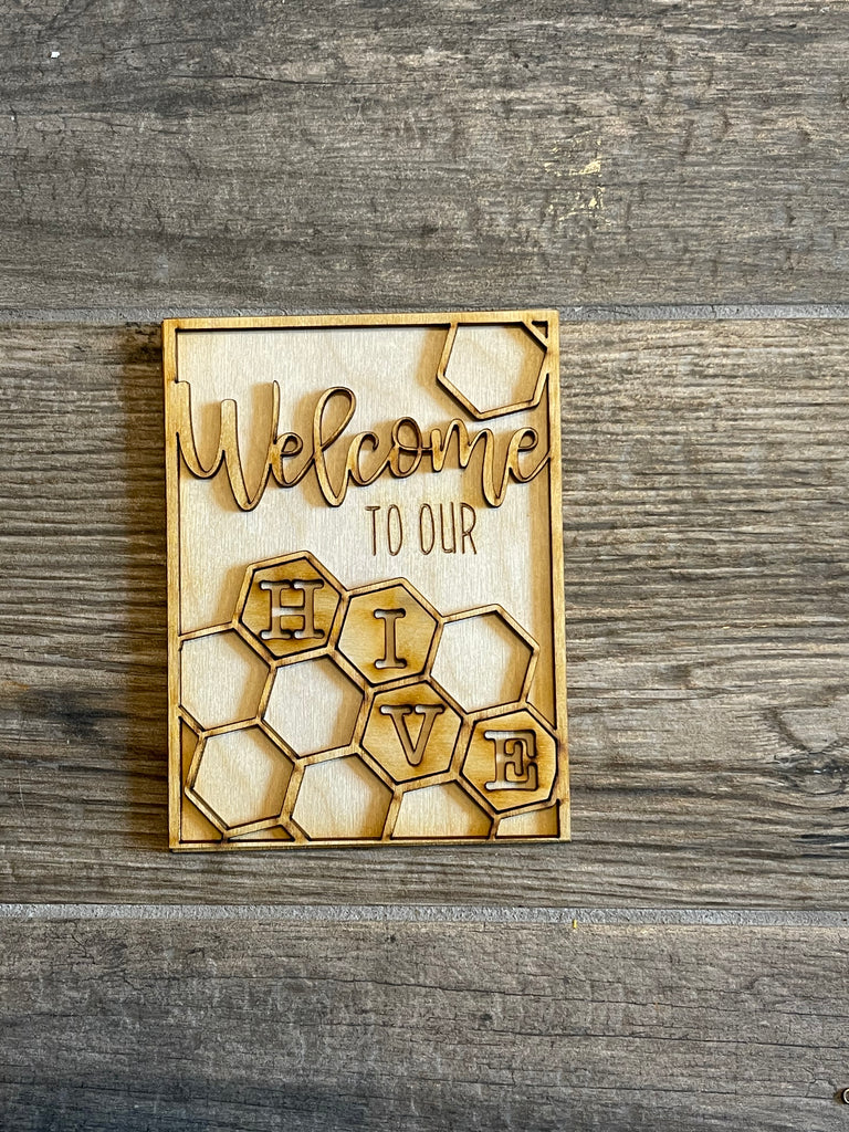 Customize your own wooden sign with our Little August Ranch Honey Bee DIY Tiered Tray Bundle - Beehive Tiered Tray Kit - Welcome to Our Hive - Local Honey - Paint it Yourself - Bee Wood Blanks. This Little August Ranch Local Honey Bee Wood Blank is the perfect canvas to create a personalized "welcome to our home" sign. With our Little August Ranch DIY sets.