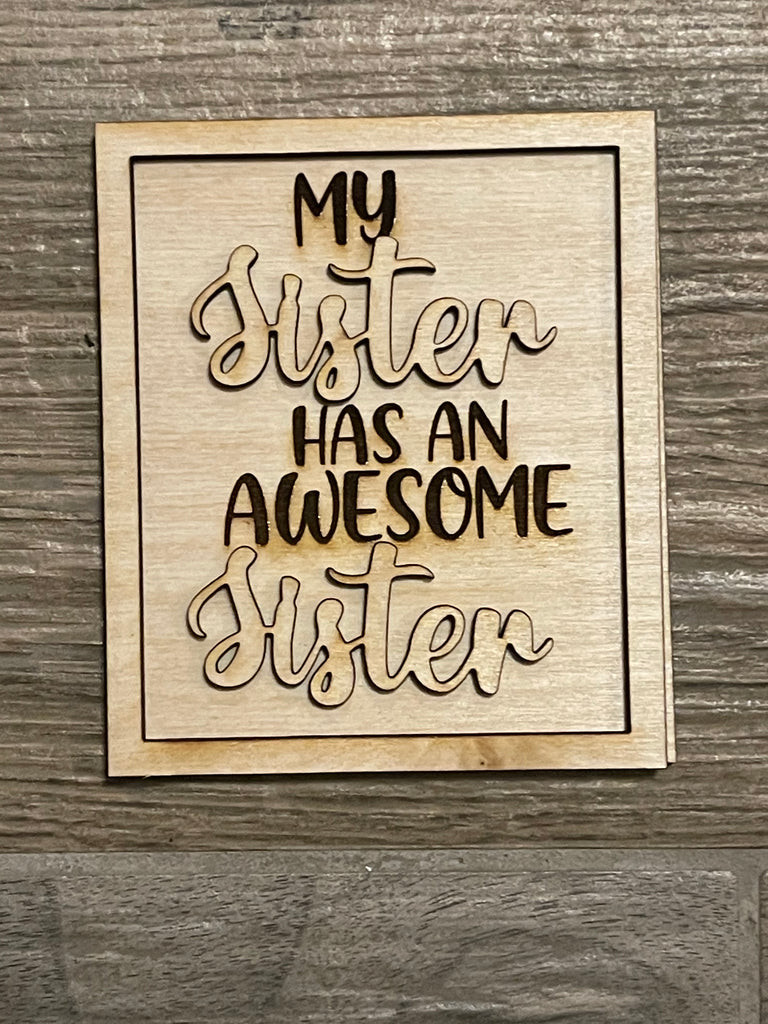 This DIY Sisters Tiered Tray - Wood Blanks - My Sister - Family Paint Set by Little August Ranch includes a wooden sign with the phrase "my sister has an awesome sister," perfect to display on a Sister Tiered Tray or any wood blanks project.