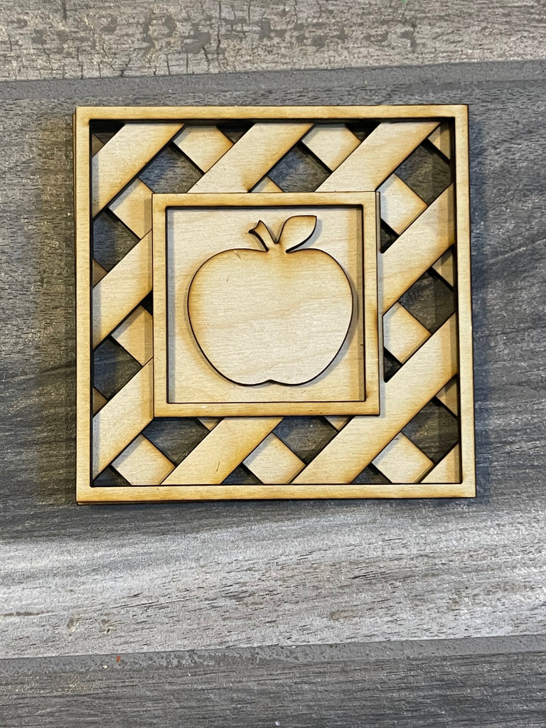 A wooden square with an Apple Tiered Tray DIY Paint Kit - Farmers Market Wood Blanks - U-Pick- Summer Paint Kit by Little August Ranch in it, perfect for a Farmers Market Paint Kit project.