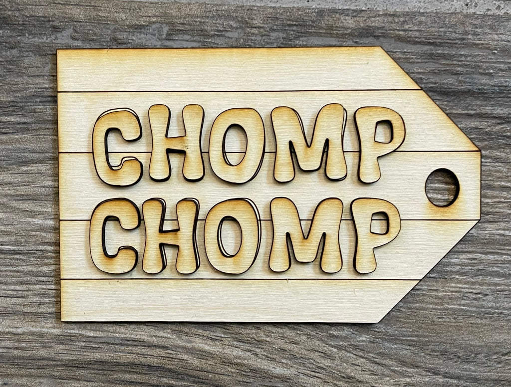 A Shark Tiered Tray - Shark Week Themed Tiered Tray - Beach Decor - Fins Up with the brand name Little August Ranch, with the word chomp chomp on it.