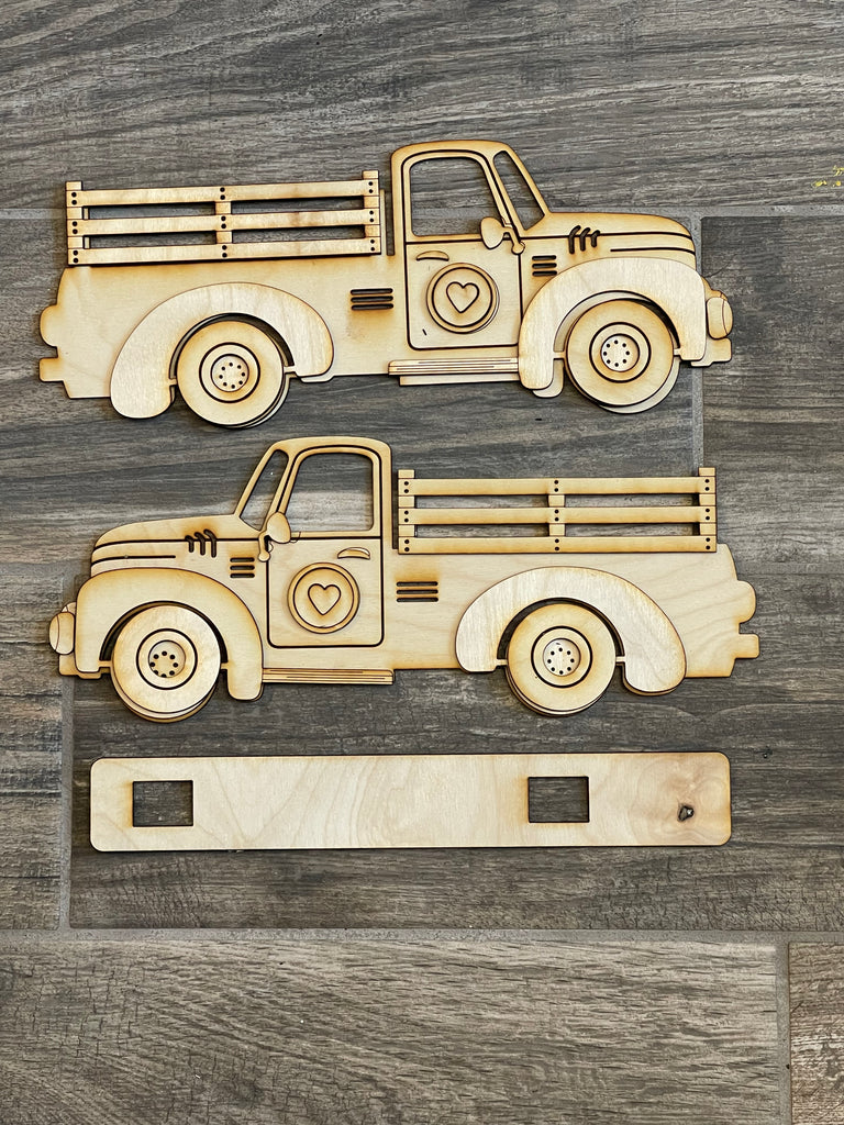 Two Little August Ranch Standing Vintage Truck DIY - Base for Interchangeable Inserts - Tiered Tray Decor - Freestanding Shelf Decor - Paint it Yourself Kit wooden truck cutouts on a wooden surface.