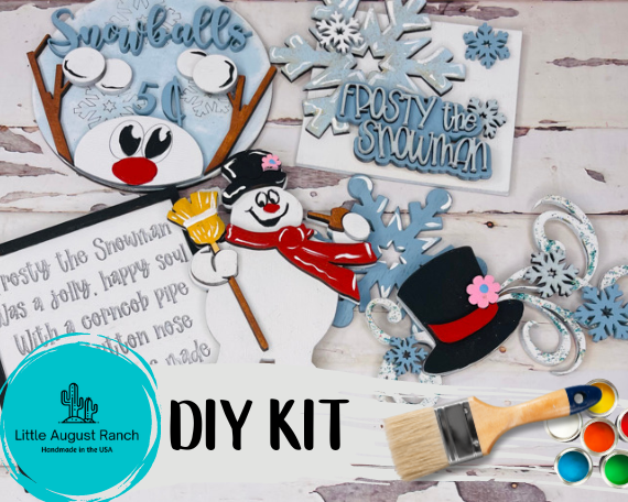 A DIY Tiered Tray Winter Snowman - Magic Hat Christmas Wood Kit with paint and paintbrushes by Little August Ranch.