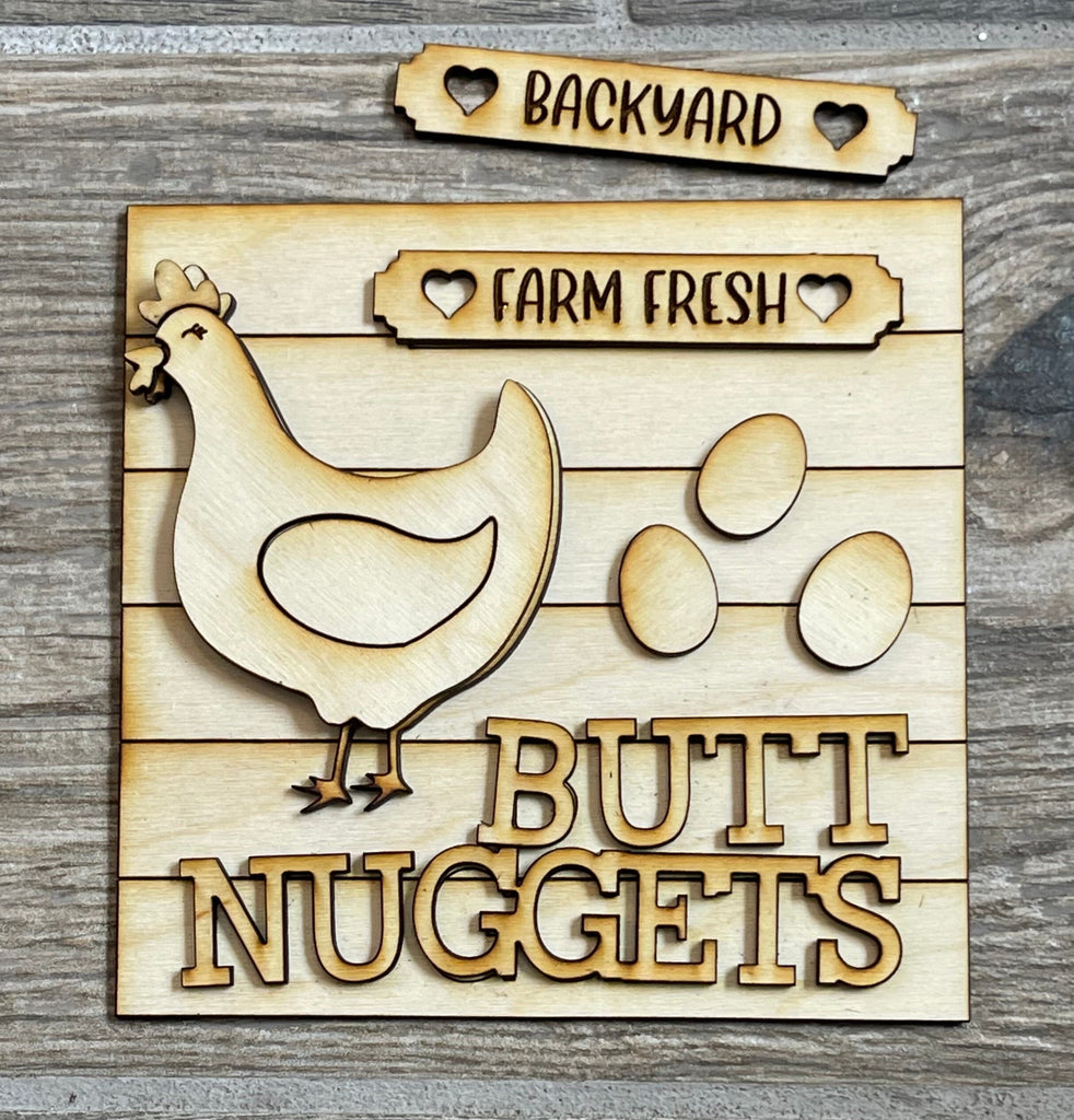 A wooden sign for a Chicken Farm with a chicken and eggs, like the Funny Chicken DIY Tiered Tray - Butt Nuggets from Little August Ranch.