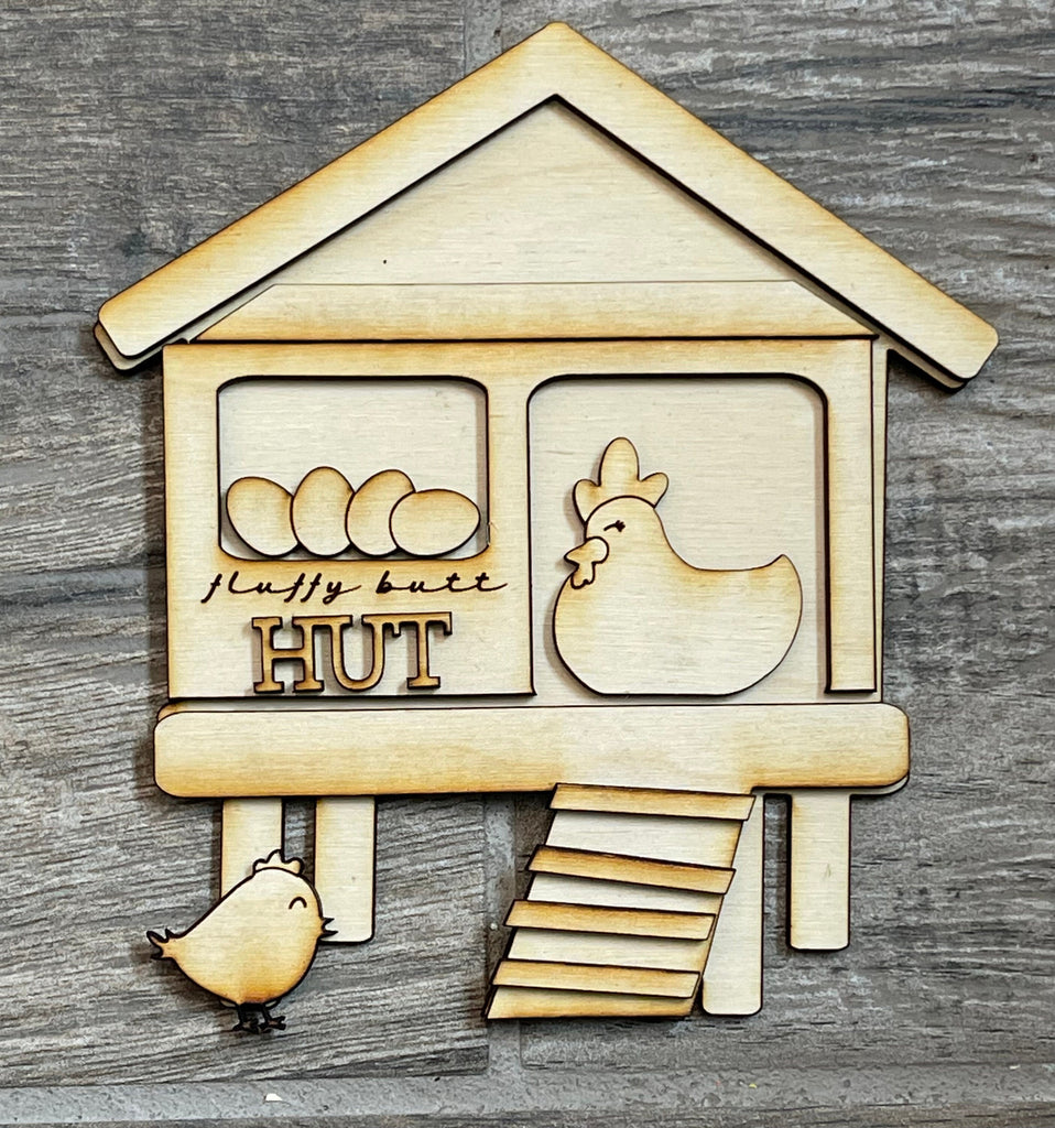 A wooden chicken coop with a Funny Chicken DIY Tiered Tray - Butt Nuggets and a DIY Kit chicken coop from Little August Ranch.