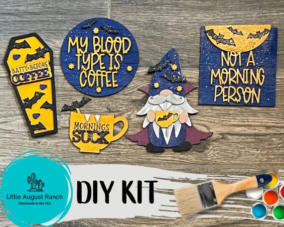A Halloween DIY gnome kit with a paint brush and paint. becomes: A Little August Ranch DIY Halloween Coffee Tiered Tray - Wood Blank Paint Kit with a paint brush and paint.