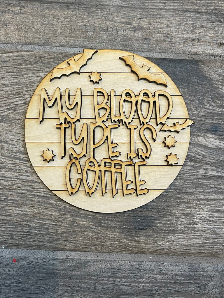 A wooden sign that says my blood type is coffee, perfect for a Little August Ranch DIY Halloween Coffee Tiered Tray - Wood Blank Paint Kit decoration.