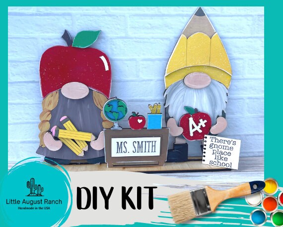 A DIY kit with two School Freestanding Wood Gnome Outfits- Teacher Interchangeable Gnomes and an apple from Little August Ranch.