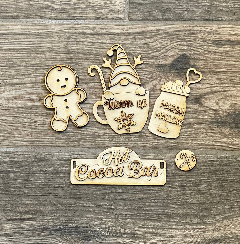 A wooden sign with a gingerbread man and a mug, designed for tiered tray bases, featuring the Little August Ranch Hot Cocoa Insert DIY - Inserts for Interchangeable Inserts.