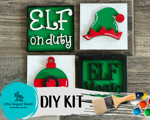 A Little August Ranch DIY craft kit with Christmas elf-themed decorations, including a paintbrush and scissors, and wooden leaning ladder items.